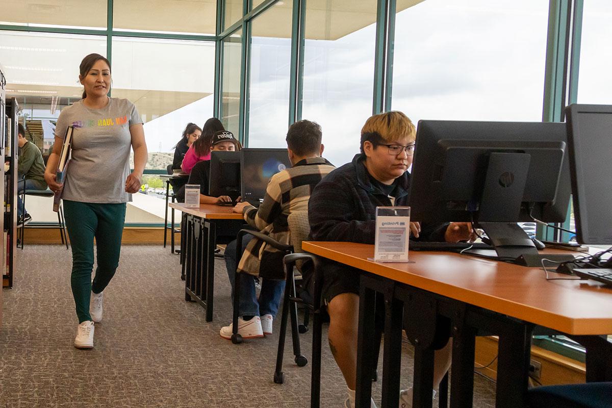 Group of students studying in front of their computers in the library at SJC